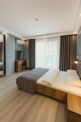 a bedroom with a large bed and a large window at On4 Rooms & Suites in Istanbul