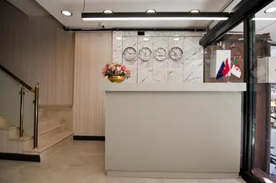 a lobby with a counter with a vase of flowers at Grand Bagoz Hotel in Istanbul