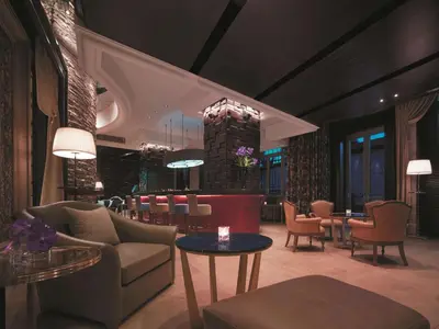 a lobby with chairs and a bar in a hotel at Shangri-La Bosphorus, Istanbul in Istanbul