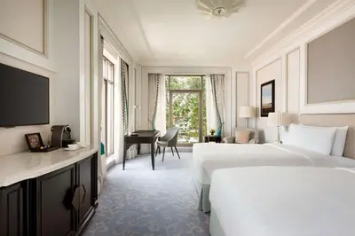 a hotel room with two beds and a desk at Shangri-La Bosphorus, Istanbul in Istanbul