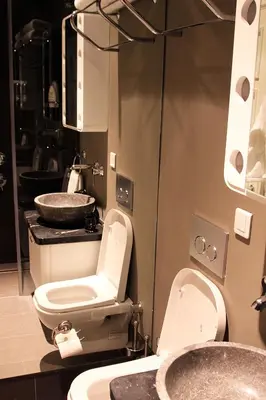 a bathroom with a toilet and two sinks at Frida Suites in Istanbul