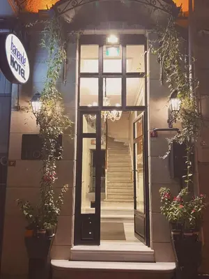 a front door of a building with potted plants at HANENDE HOTEL in Istanbul
