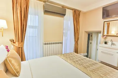 a hotel room with a bed and a window at HANENDE HOTEL in Istanbul