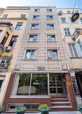 a tall building with stairs in front of a store at Mint Residence Taksim in Istanbul
