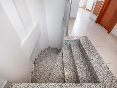 a hallway with a floor that has a drain at Mint Residence Taksim in Istanbul