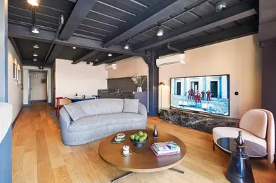 a living room with a couch and a fireplace at Stay Lab Residence in Istanbul
