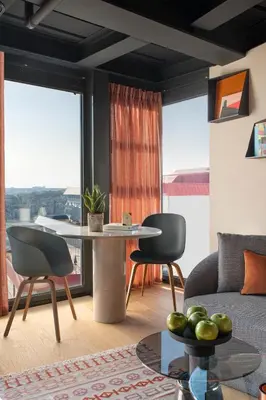 a living room with a table and two chairs at Stay Lab Residence in Istanbul