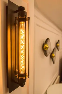 a lantern hanging on a wall with a door at The 22 Hotel in Istanbul