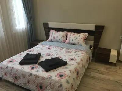 a bedroom with a bed with two black bags on it at PASHA APART~BOUTİQUE HOTEL/YALOVA in Yalova