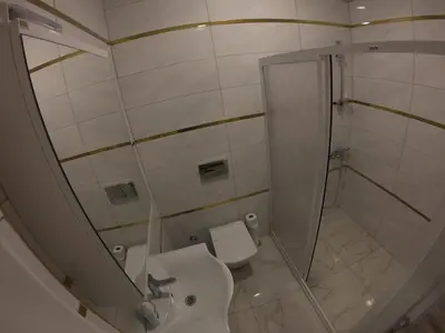 a bathroom with a shower and a toilet and a sink at PASHA APART~BOUTİQUE HOTEL/YALOVA in Yalova