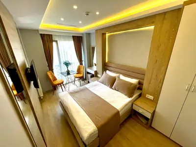 a hotel room with a large bed and a table at Zem Hotel in Istanbul