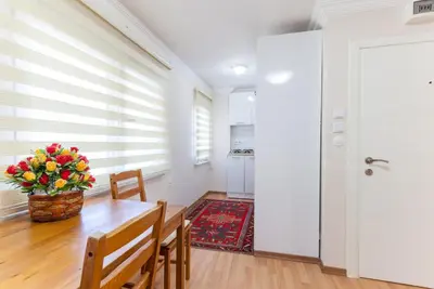 a dining room with a table and chairs at Sultan Apartments in Istanbul