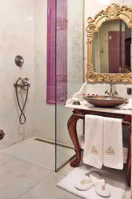 a bathroom with a sink and a mirror at Daru Sultan Hotels Galata in Istanbul