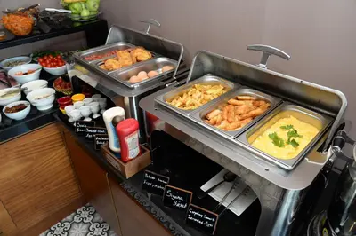 a buffet with some food on a table at Pera Luna Residence in Istanbul