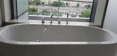 a white sink in a bathroom with a window at Ataköy Marina Park Hotel Residence in Istanbul