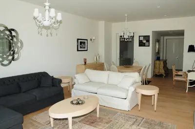 a living room with a couch and a table at Ataköy Marina Park Hotel Residence in Istanbul
