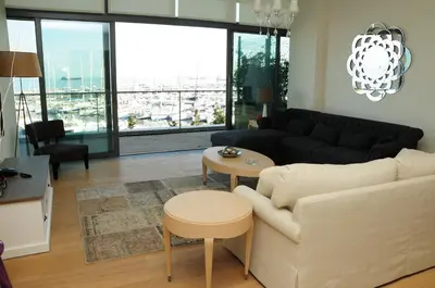 a living room with a couch and a table at Ataköy Marina Park Hotel Residence in Istanbul