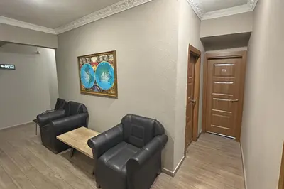 a waiting room with leather chairs and a table at Biter Hotel in Istanbul