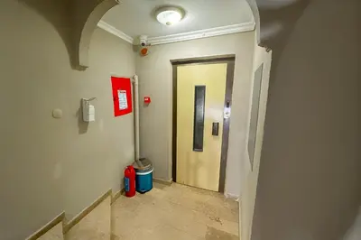a hallway leading to a door in a building at Biter Hotel in Istanbul