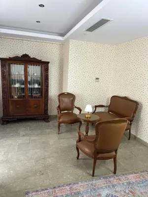 a waiting room with chairs and a table and a cabinet at Liberi Hotel Taksim in Istanbul