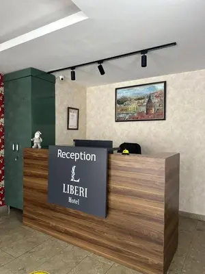 a reception desk with a sign for a library at Liberi Hotel Taksim in Istanbul