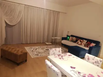 a living room with a couch and a table at Have a nice holiday in Istanbul