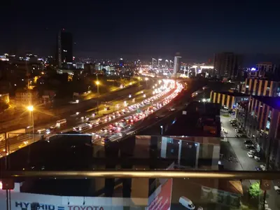 a city at night with traffic on a highway at Have a nice holiday in Istanbul