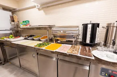 a kitchen with a bunch of food on a counter at Villa Sweet Hotel in Istanbul