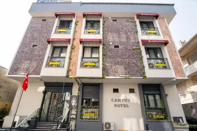 a building with a sign that reads caritas hotel at Campus Boutique Hotel in Istanbul