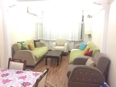 a living room with two couches and a table at Eda's Apartment in Istanbul