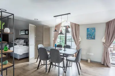a dining room with a table and chairs and a bed at DM Suites Bosphorus in Istanbul