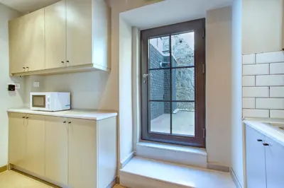 a kitchen with a window and a microwave at DM Suites Bosphorus in Istanbul