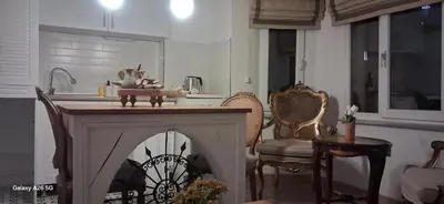 a kitchen with a fireplace in the middle of a room at The White Swan Suites Beyoglu in Istanbul
