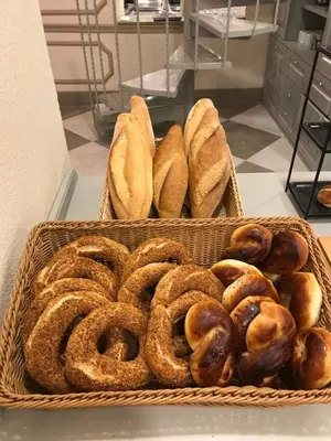 two baskets filled with different types of bread at GALATAHAN Hotel Istanbul Karakoy in Istanbul