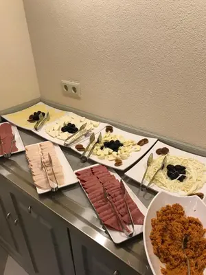 a buffet with several plates of food on a table at GALATAHAN Hotel Istanbul Karakoy in Istanbul