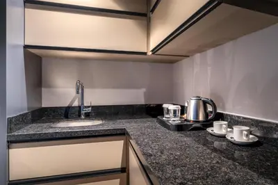 a kitchen with a sink and a counter top at Best Western Premier Hidden Hills Hotel in Istanbul