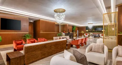 a lobby of a hotel with furniture and a tv at Best Western Premier Hidden Hills Hotel in Istanbul