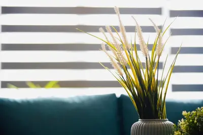 a white vase with some plants in it at LUXIR HOTEL in Istanbul