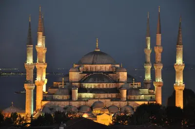 a large building with domes and mosques at night at Grand Kavi Hotel in Istanbul