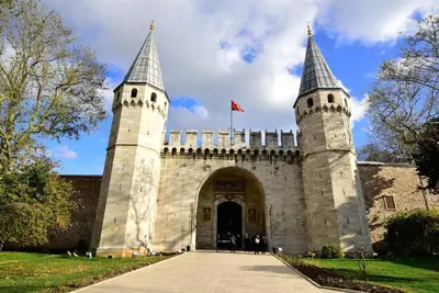 a building with two towers with a flag on it at Grand Kavi Hotel in Istanbul