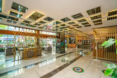 a large building with a lobby with a lot of windows at The Bostancı Otel in Istanbul