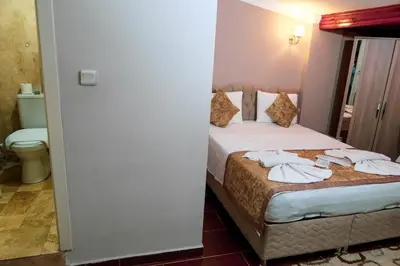a hotel room with a bed with towels on it at Ağva Carpediem Otel in Agva