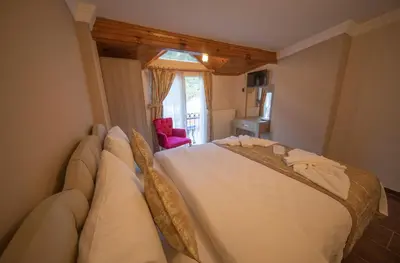a bedroom with a large bed in a room at Ağva Carpediem Otel in Agva