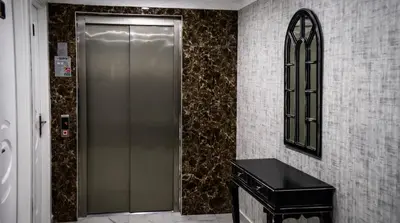 a elevator in a building with a mirror on the wall at Cnr İnci Hotel in Istanbul