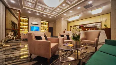 a lobby with a waiting room with chairs and a table at My Dream Istanbul Hotel in Istanbul