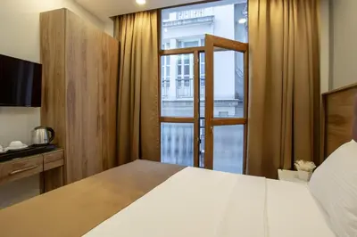 a bedroom with a large bed and a window at West Palace in Istanbul