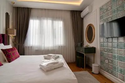 a hotel room with a bed with towels on it at Blue Mosque Suites 2 - Old City Sultanahmet in Istanbul