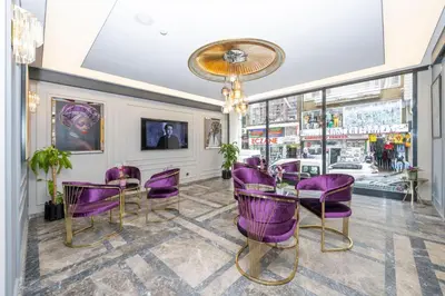 a dining room with purple chairs and a table at Graziella Gold Hotel in Istanbul