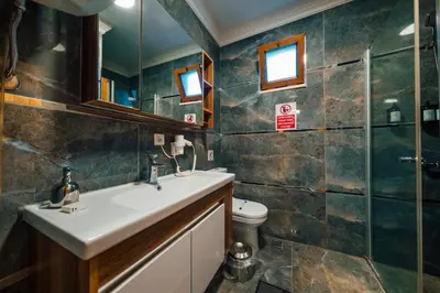 a bathroom with a sink and a toilet at antik river house in Sile