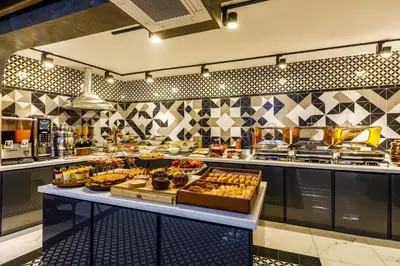 a buffet line with many different types of food at Euro Design Hotel in Istanbul